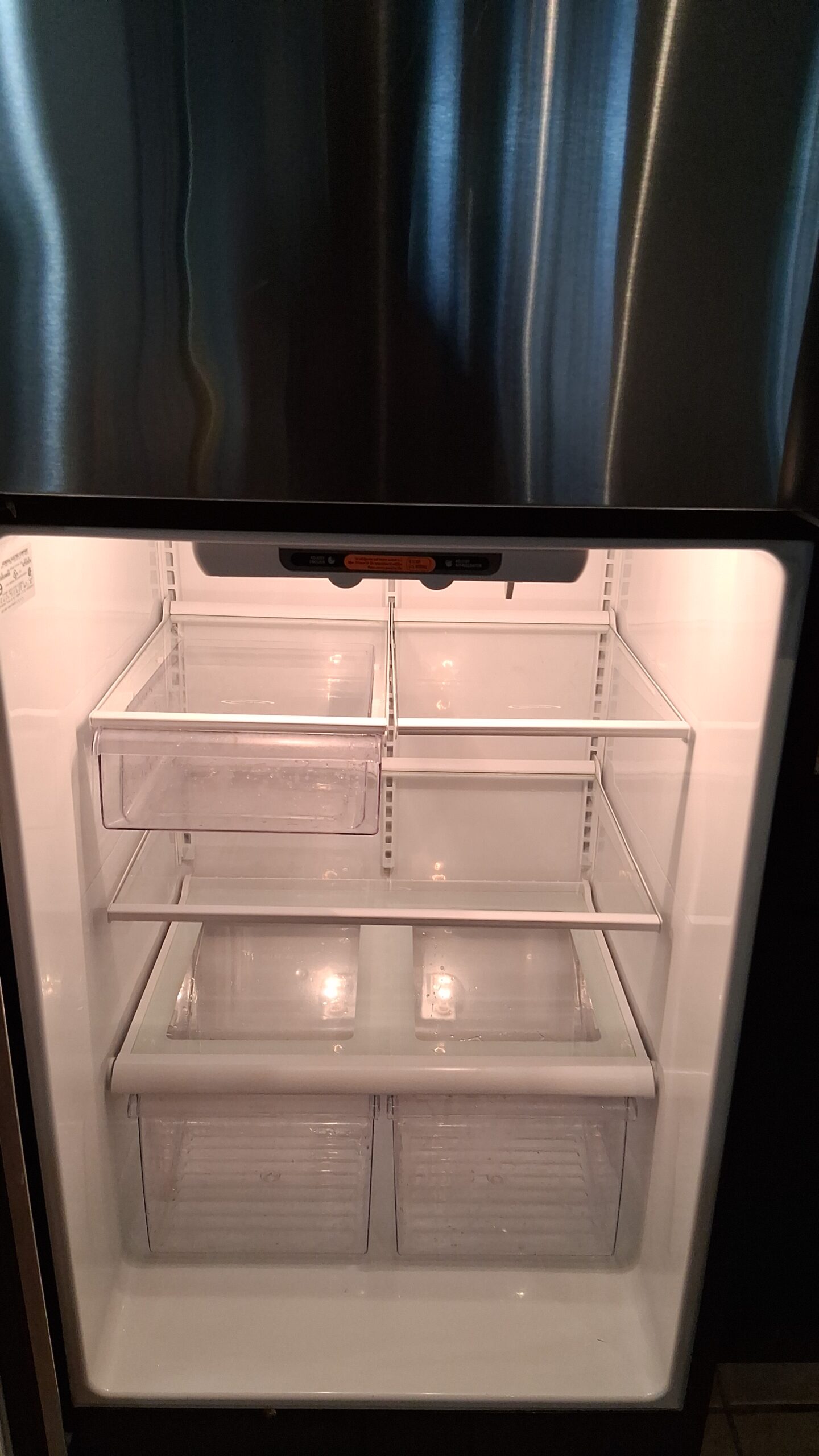 A sparkling clean refrigerator in Sandy Springs, professionally cleaned by Mkleaning to ensure a fresh and move-in ready kitchen for new residents.