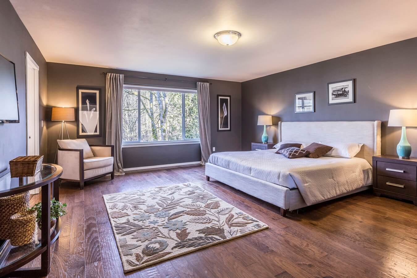 Professional recurring cleaning by Mkleaning in a beautifully maintained high-end bedroom with bed, carpet, armchair, and floor in Johns Creek.
