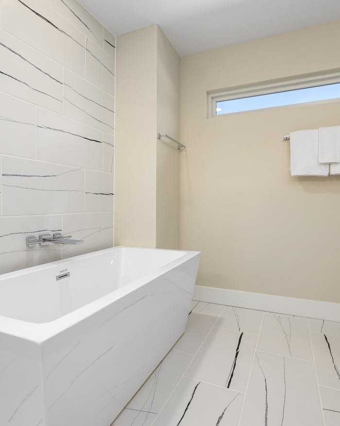 Professional recurring cleaning by Mkleaning in a beautifully maintained high-end white bathroom in Roswell.