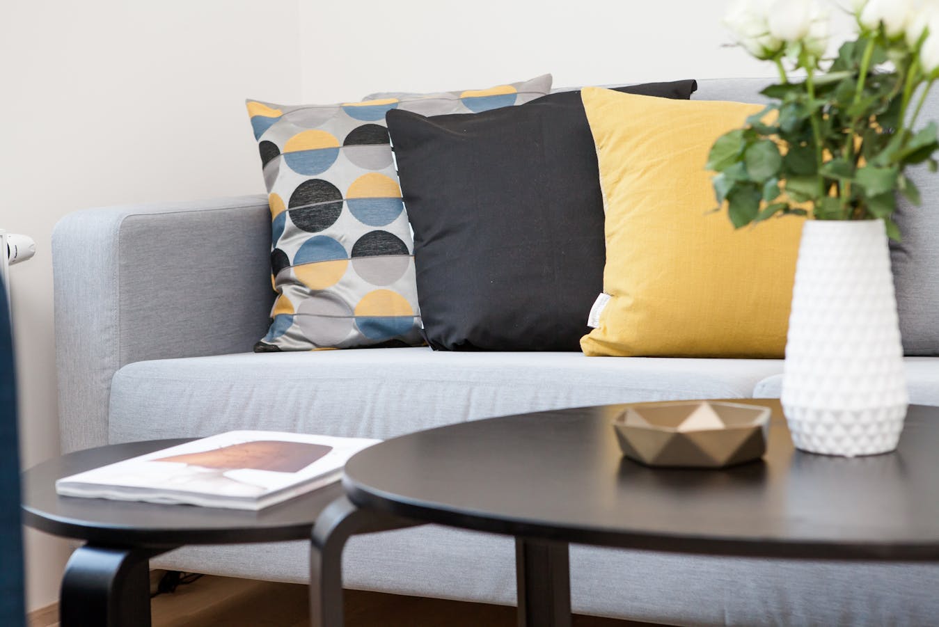 Professional recurring cleaning by Mkleaning in a beautifully maintained high-end living room with sofa and neatly arranged cushions in Milton.