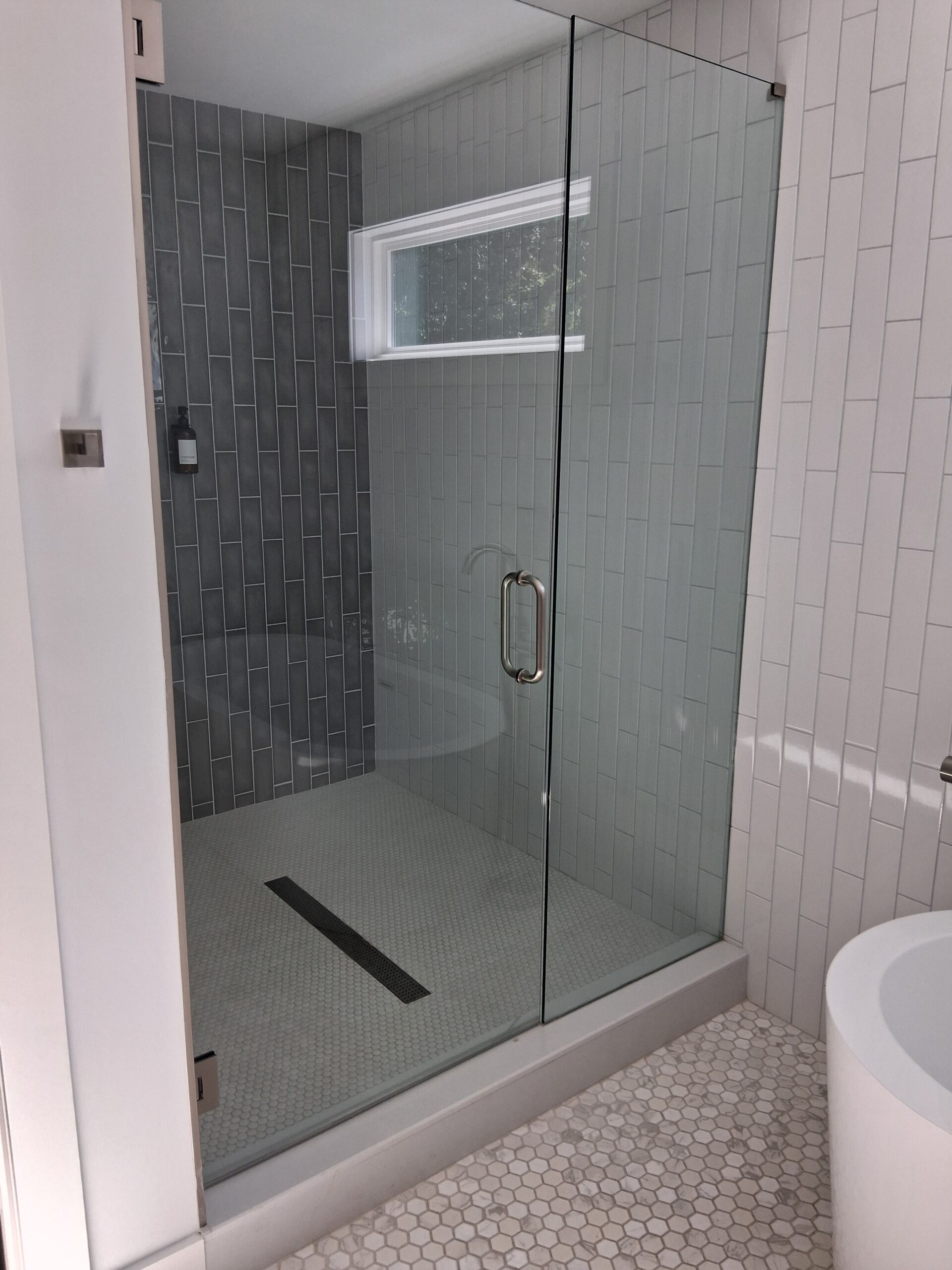 Professional recurring cleaning by Mkleaning in a beautifully maintained high-end bathroom with spotless and organized shower in Milton.