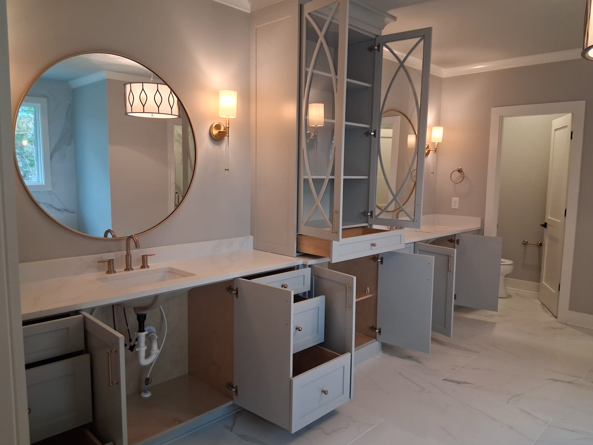 Move-out cleaning of a master bathroom with detailed vanity, drawers, mirrors, and floor cleaning
