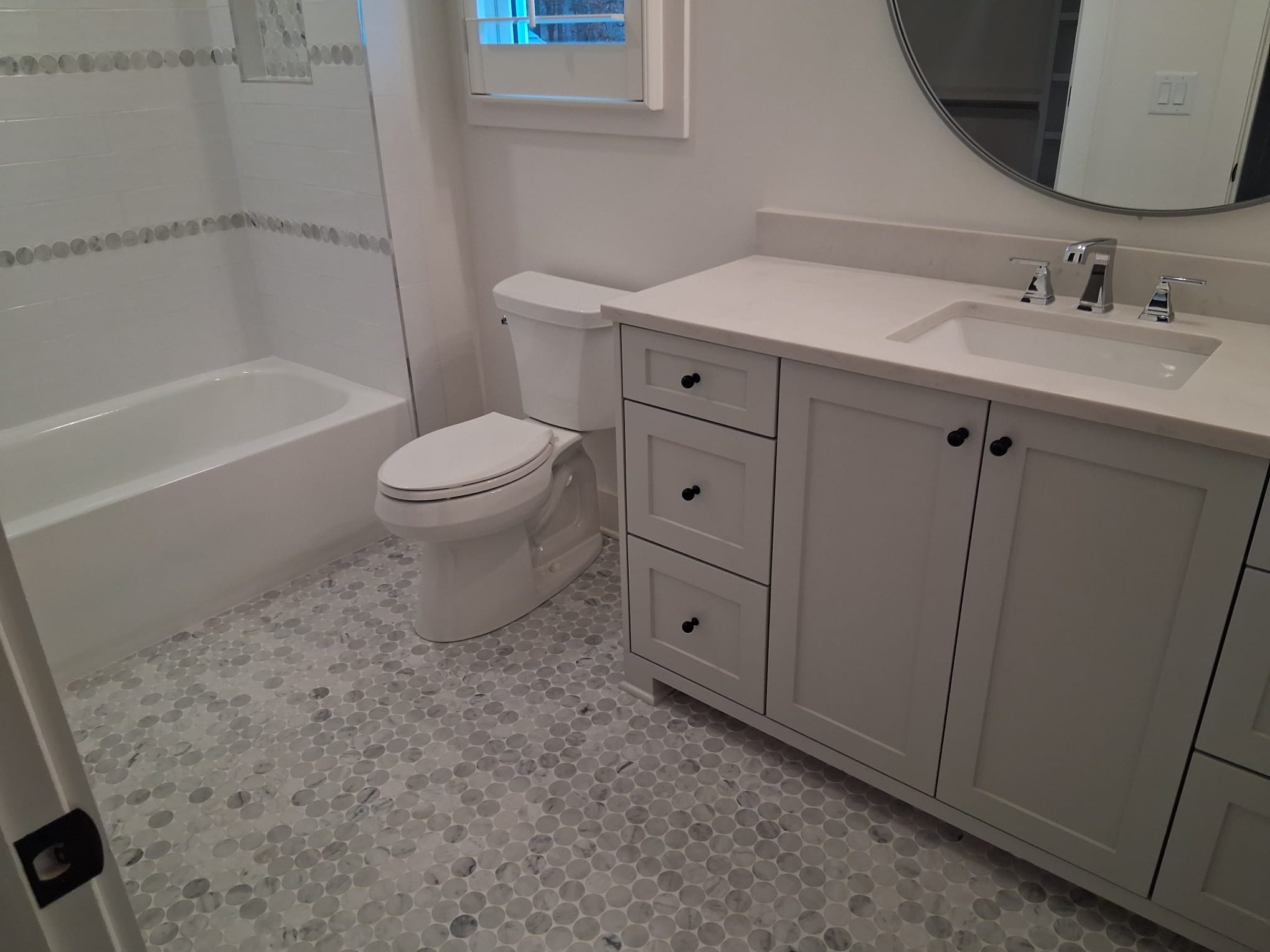 Professional bathroom cleaning with sanitized toilet, vanity, and shower for a fresh and hygienic space