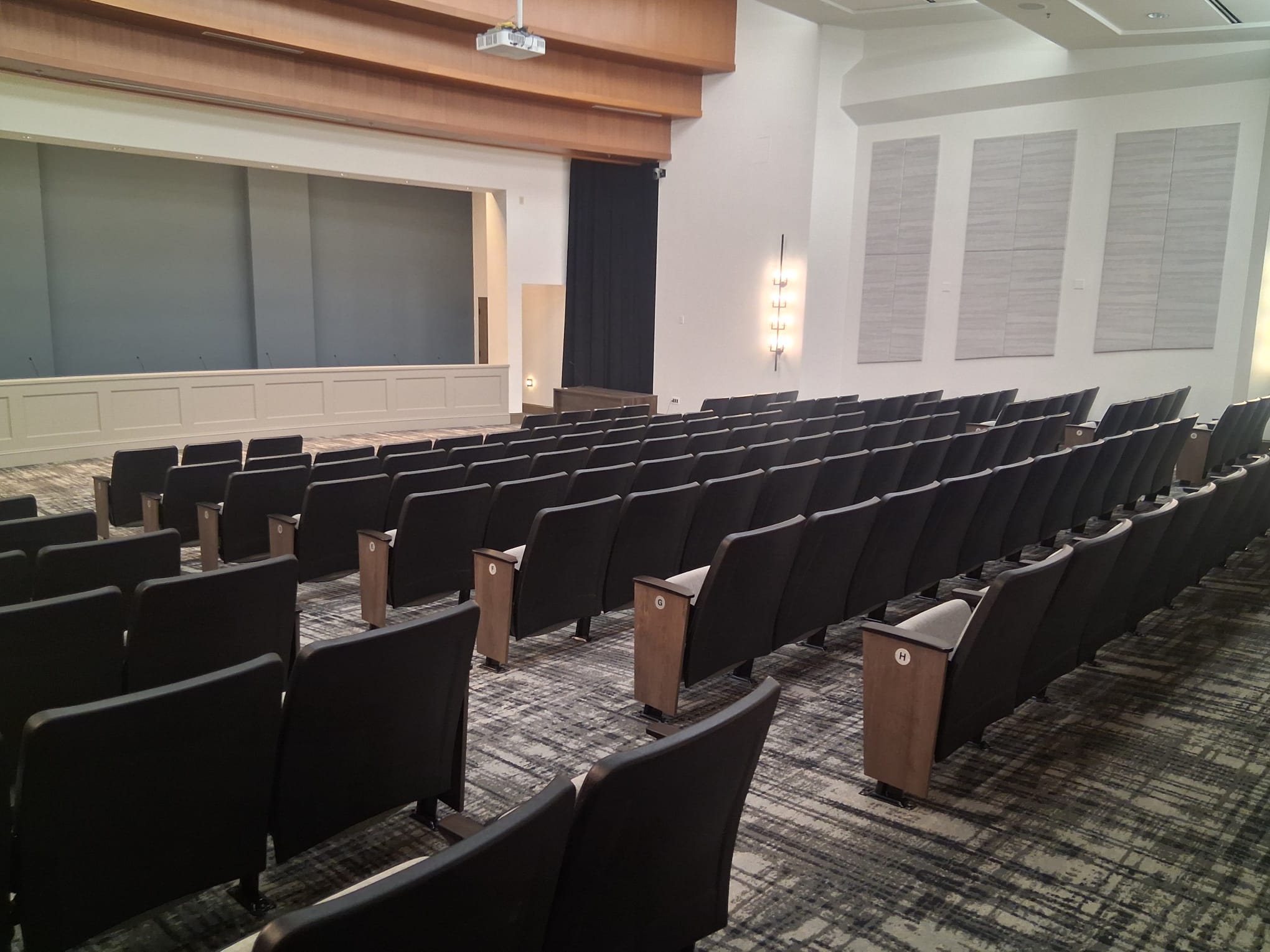 Regular cleaning of a conference center used as office space, with organized seating and clean high-traffic floors
